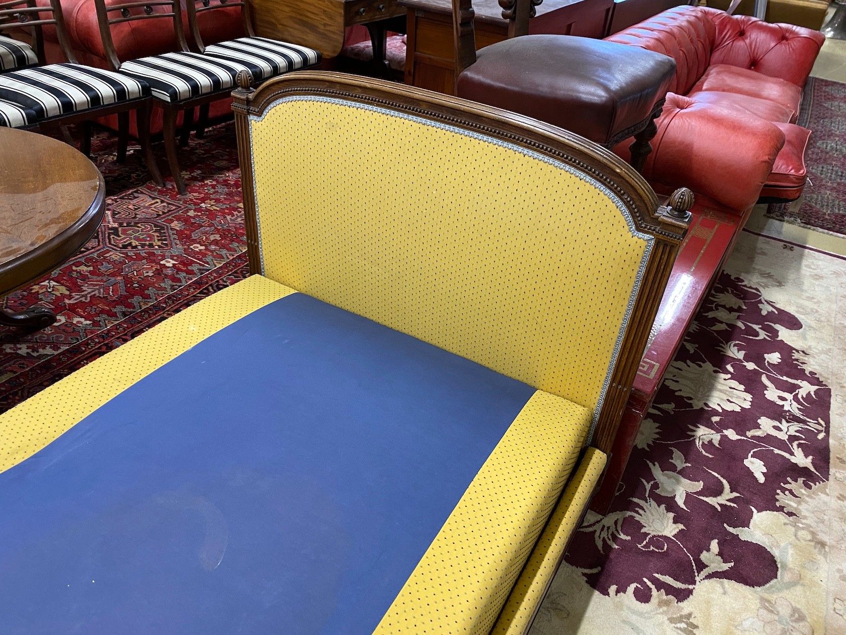 An early 20th century French mahogany day bed, length 200cm, depth 98cm, height 92cm
